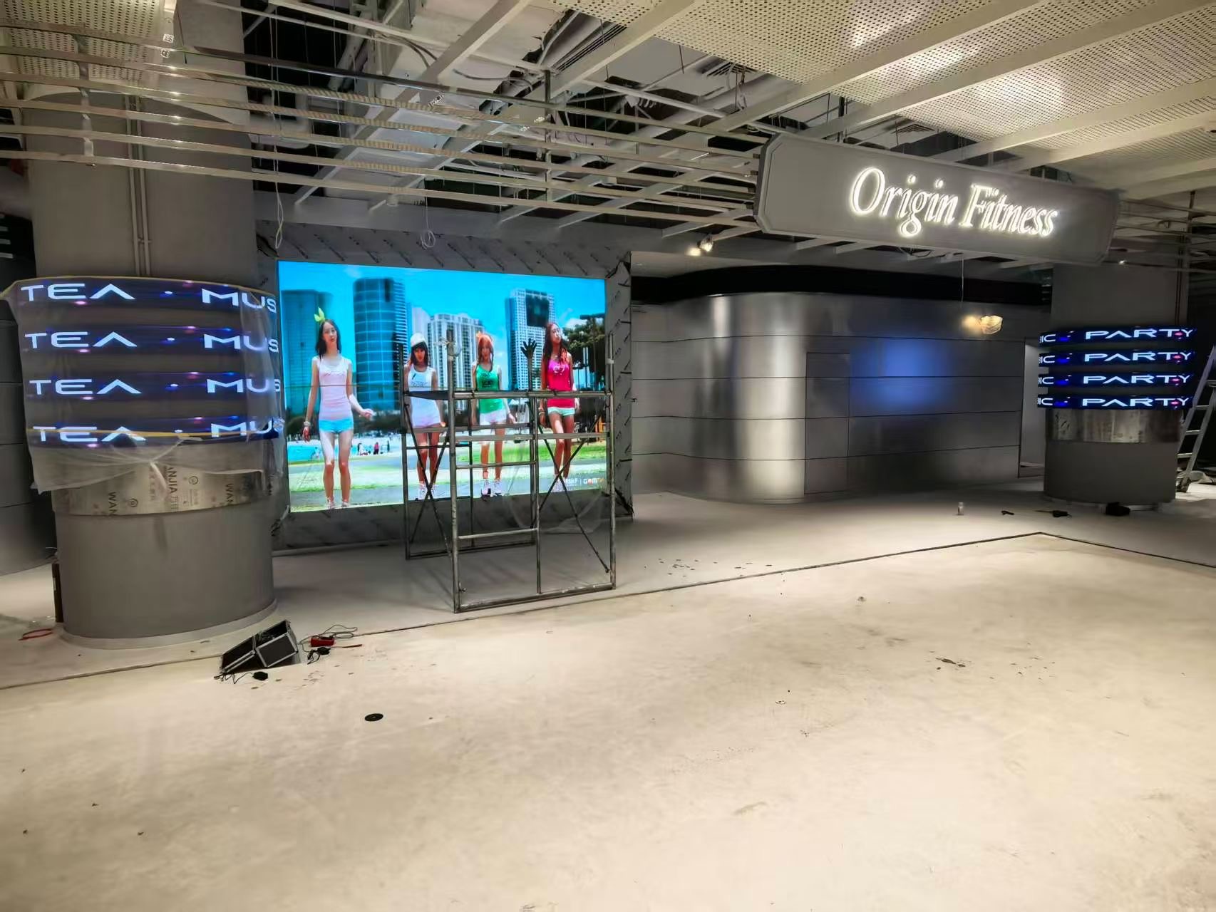 LED display outdoor rental rigged by technicians at an outdoor event