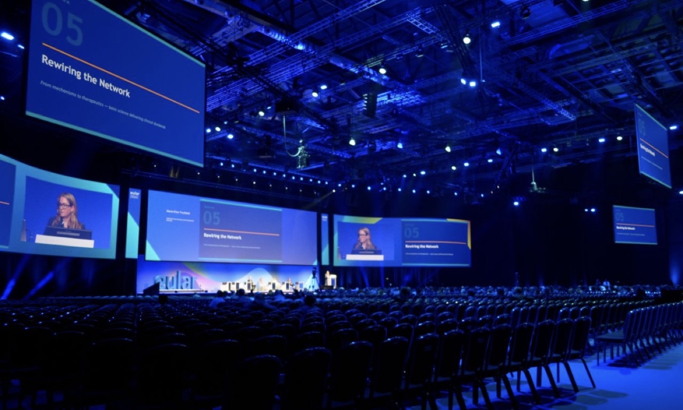 Session title displayed on the curved LED screen at the EULAR 2026 congress in London