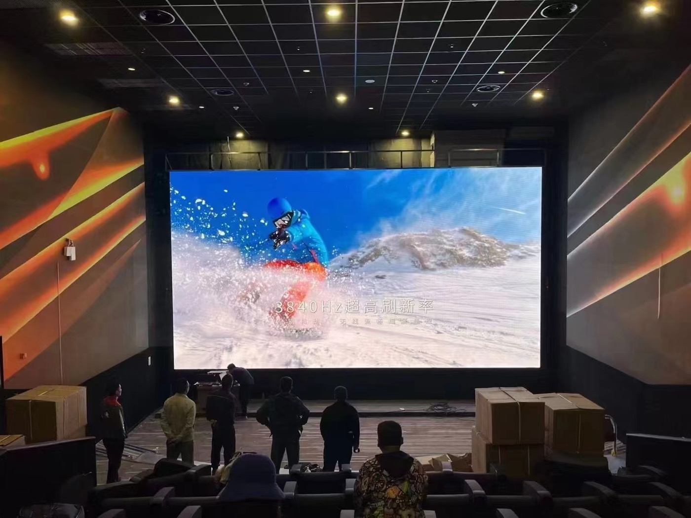Indoor cinema LED screen showing a film